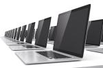 Zdjęcie przedstawiające czarne laptopy ustawione w rzędach