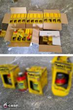 Na podłodze w pudełkach żółte opakowania z napisem Testo.